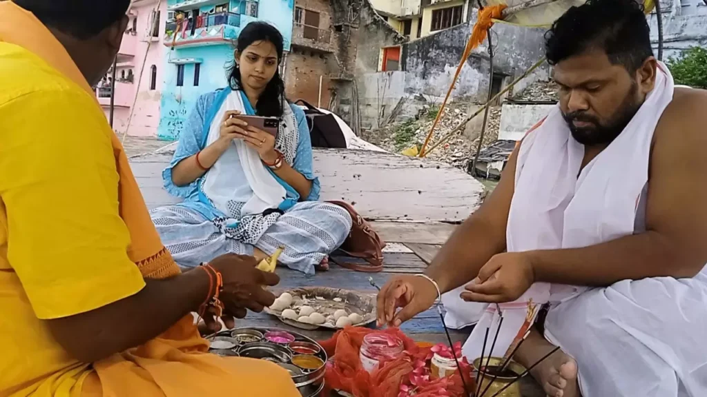 Image of a person doing pind daan - Understanding Pitru Paksha