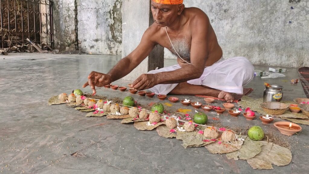 Image of a person doing pind daan rituals- Pitrupaksha Journey from Gaya to Badrinath