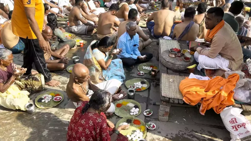 Image of a group doing pind daan- Symbolism in PitruPaksha