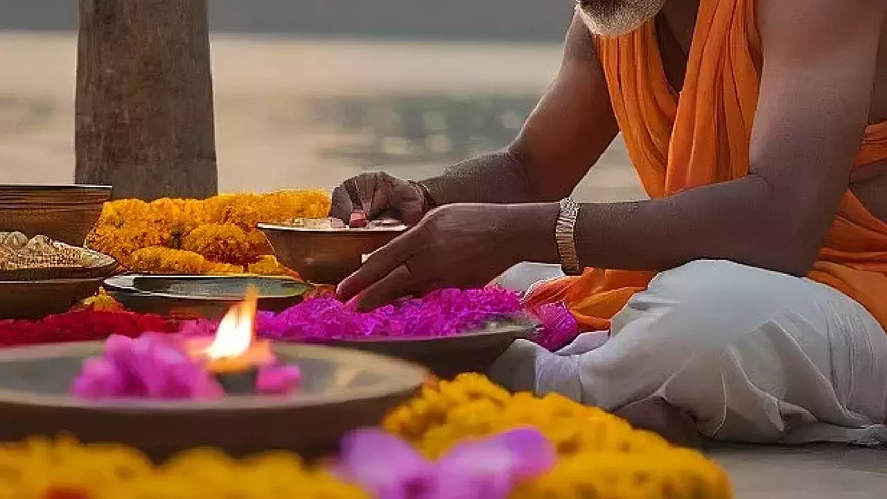 IMage of a man doing shradh ritual -What is Pitrupaksha