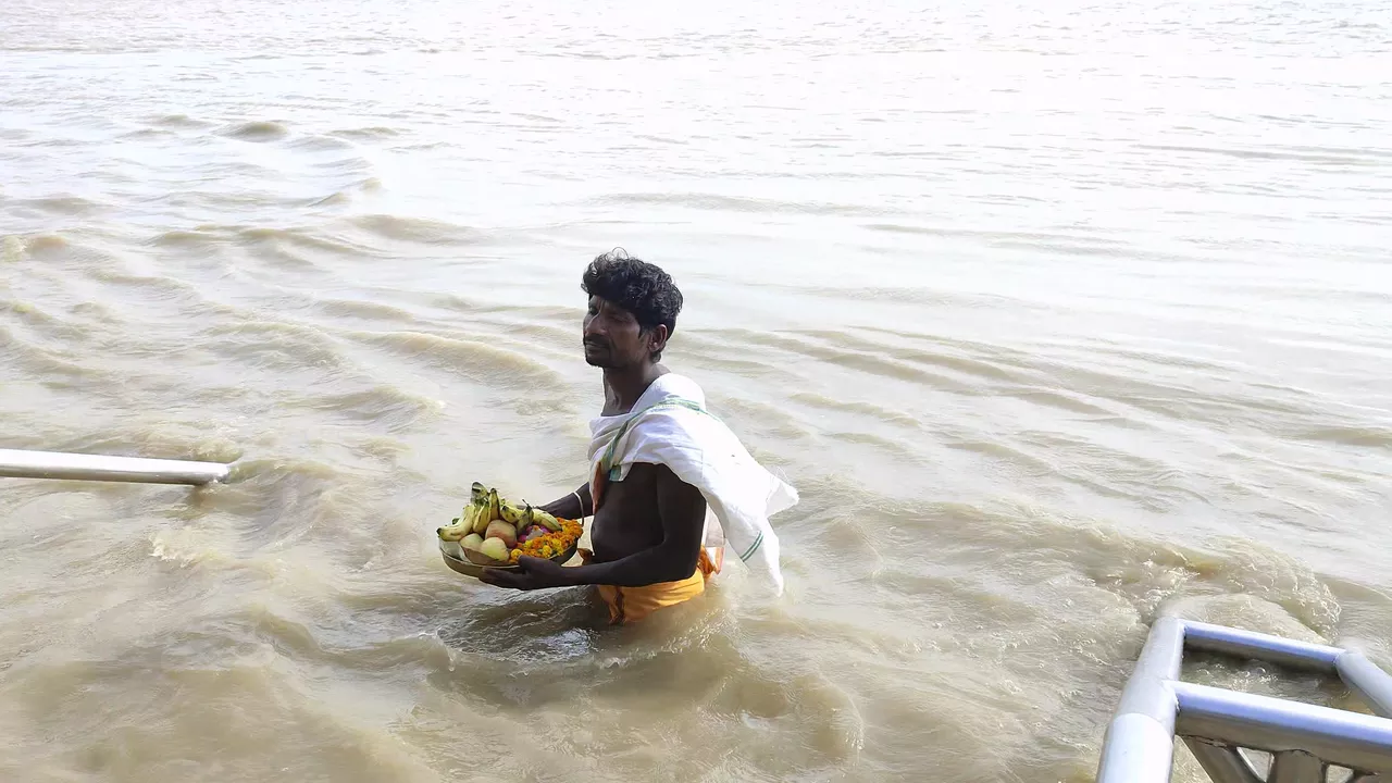 Photo of a person immersing pindas in ganga. if Shraddha Is not Performed?