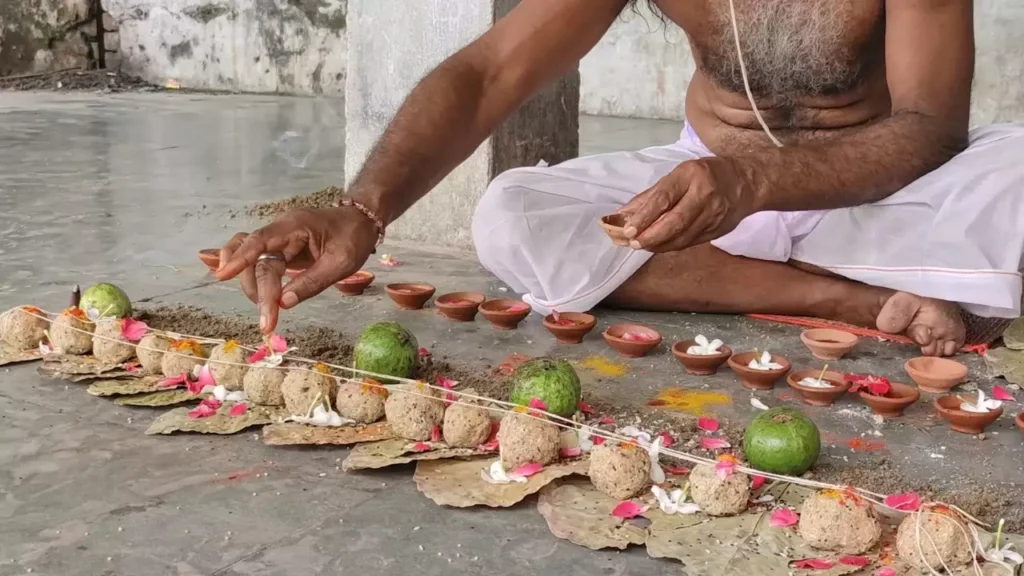 Image of a person doing pind daan -Pitru Shaap Stories Legends