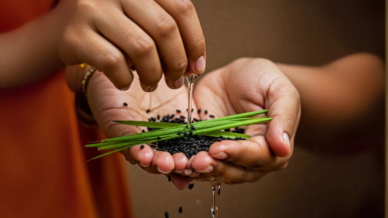Image of performing Tarpan ritual with Kusha grass, black sesame seeds (til), and pouring water- Simple Tarpan mantras